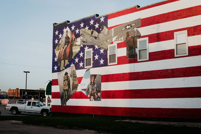 an american flag painted on the side of a building