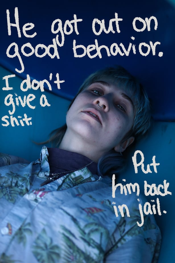 A person lying on a blue metal background with text that says "He got out on good behavior. I don't give a sh*t. Put him back in jail."