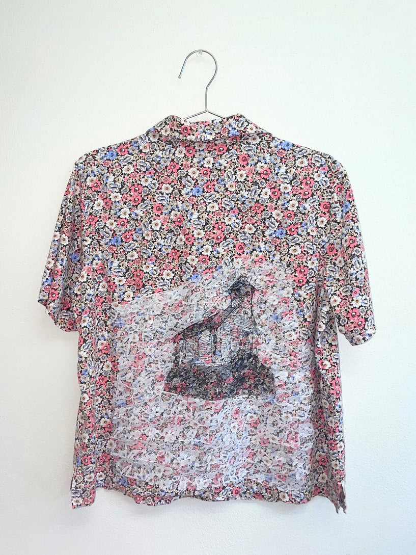 a floral shirt with an image of a church on it