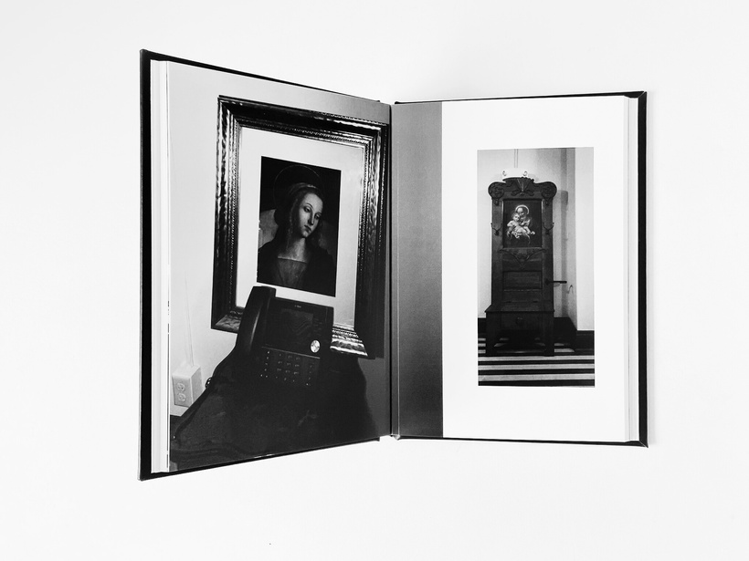 an open book with black and white photos of Catholic furniture on it